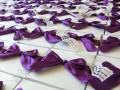 2009/07/31/purple-wedding-invitations-in-boxex-tied-with-satin-bows_by_tmdesign.jpg